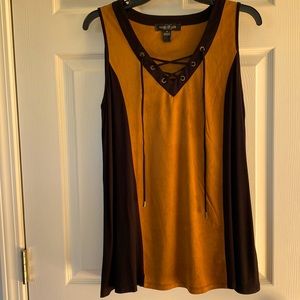 Find sleeveless tunic top in suede cloth.